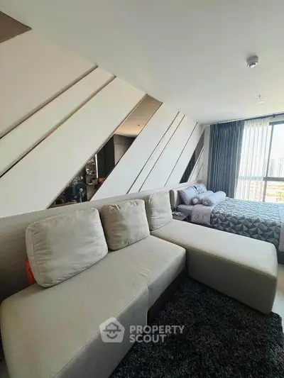 Modern living room with stylish decor and comfortable seating in a contemporary apartment.