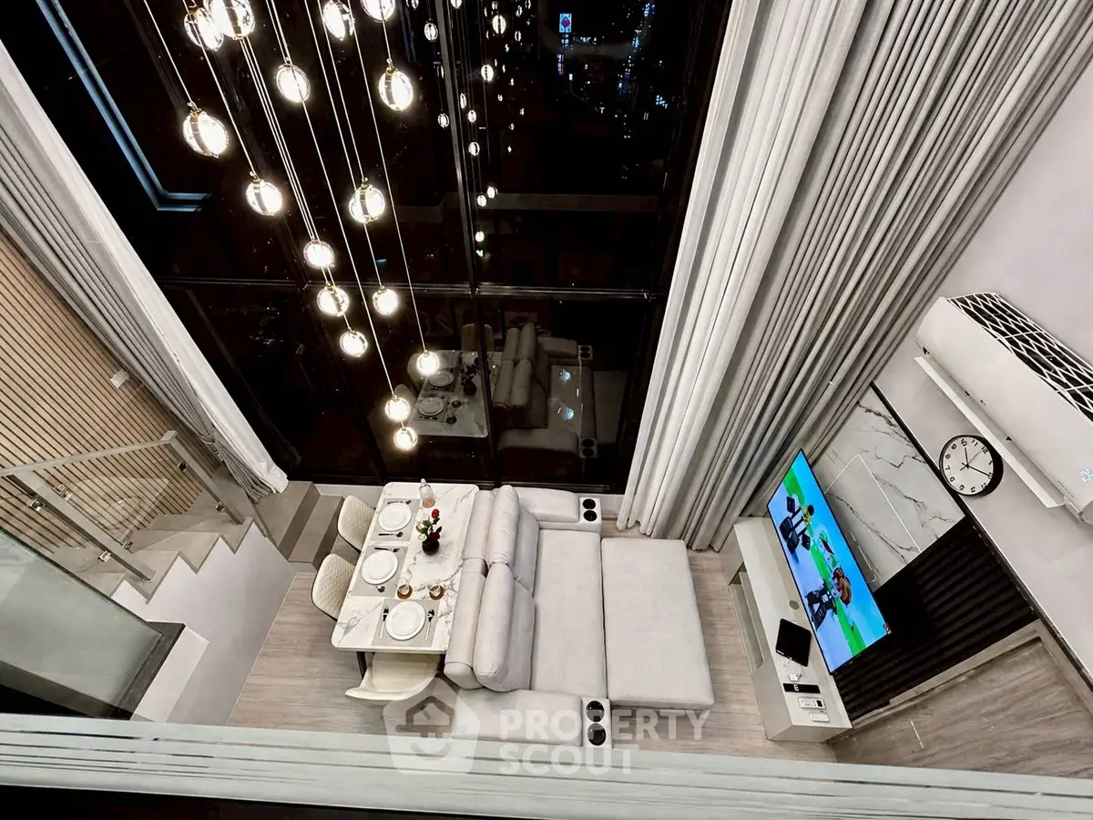 Luxurious modern living room with high ceilings and elegant lighting