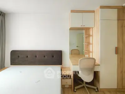 Modern bedroom with stylish wooden furniture and cozy workspace