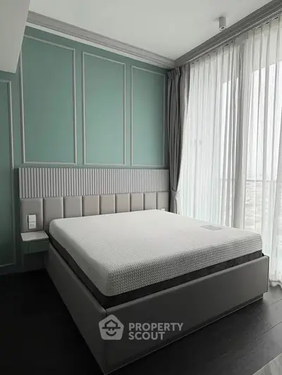 Elegant bedroom with modern design and large windows for natural light