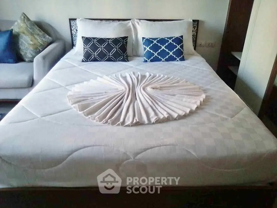 Elegant bedroom with stylish bedding and decorative pillows