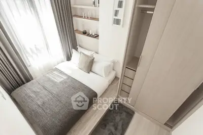 Modern minimalist bedroom with built-in wardrobe and natural light