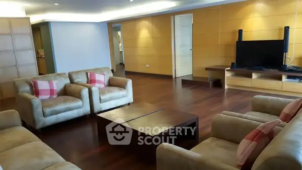 Spacious living room with modern furniture and wooden flooring