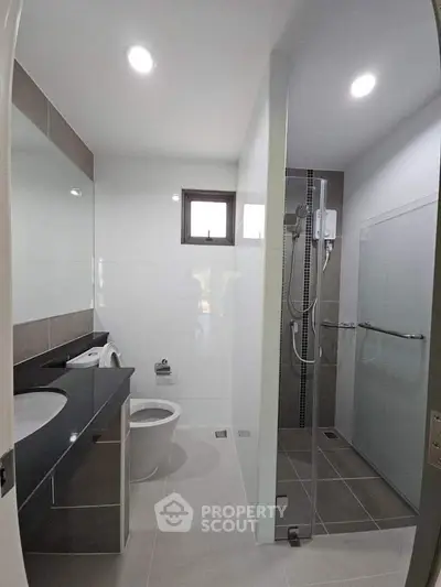 Modern bathroom with sleek design and glass shower enclosure