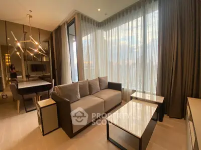 Modern living room with floor-to-ceiling windows and elegant furnishings