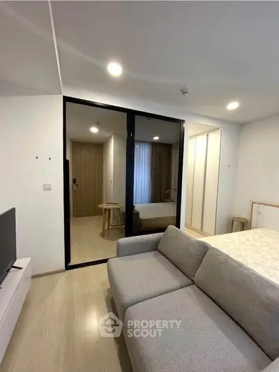 Modern studio apartment with sleek design and cozy living area