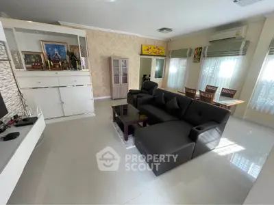 Spacious living room with modern furniture and ample natural light