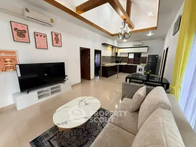 Spacious open-plan living room with modern kitchen and elegant decor