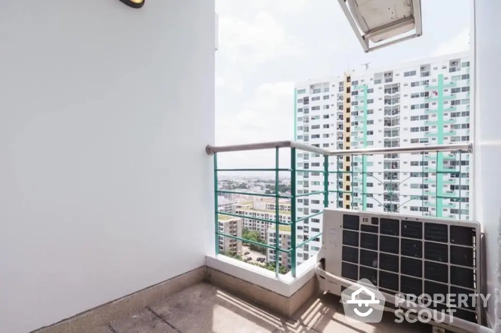 Modern apartment balcony with city view and air conditioning unit