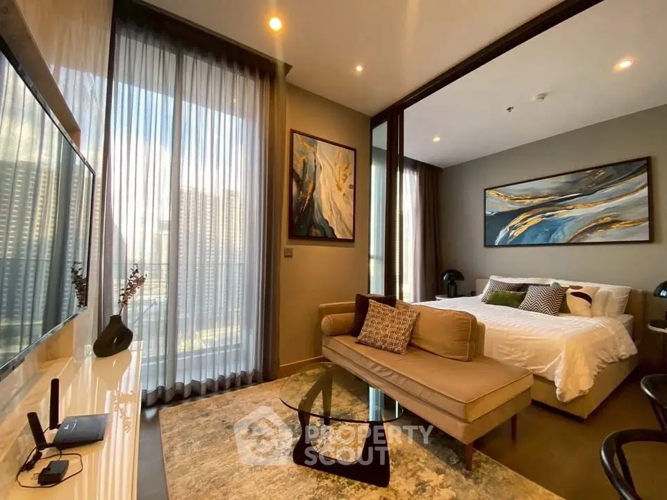 Luxurious studio apartment with modern decor and large windows