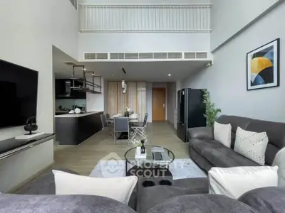 Spacious modern living room with high ceiling and stylish decor