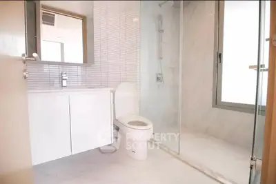 Modern bathroom with sleek design and glass shower enclosure