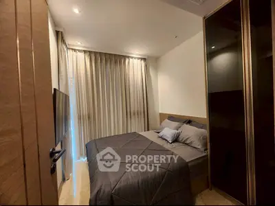 Cozy modern bedroom with elegant decor and ample natural light, perfect for relaxation and comfort.