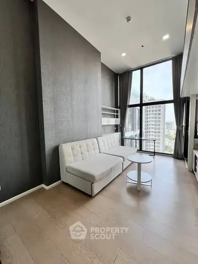 Modern living room with high ceilings and city view