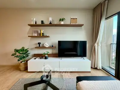 Modern living room with stylish decor and balcony view