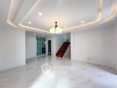 Spacious modern living room with elegant lighting and marble flooring