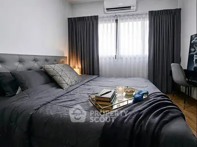 Luxurious bedroom with modern decor, plush bedding, and elegant lighting for a cozy retreat.