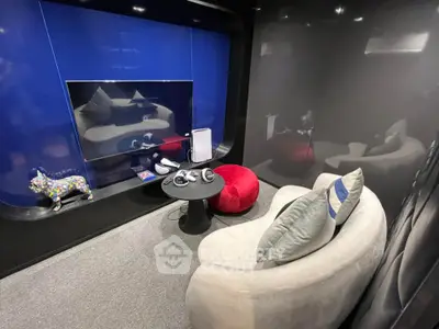 Modern entertainment room with sleek design and cozy seating, perfect for relaxation and media enjoyment.