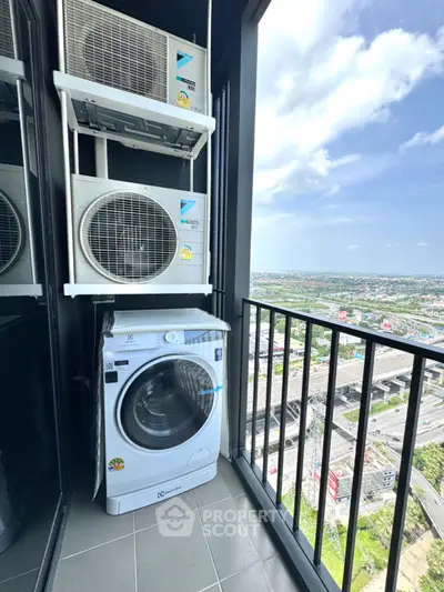 High-rise balcony with washing machine and stunning city view