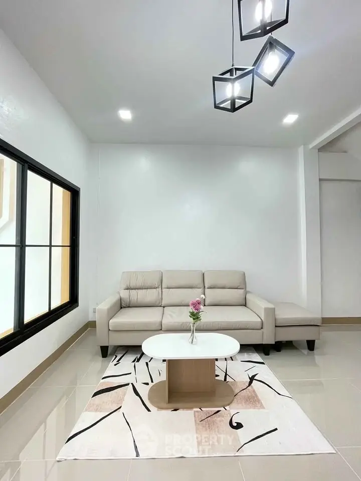 Modern living room with elegant beige sofa and stylish lighting