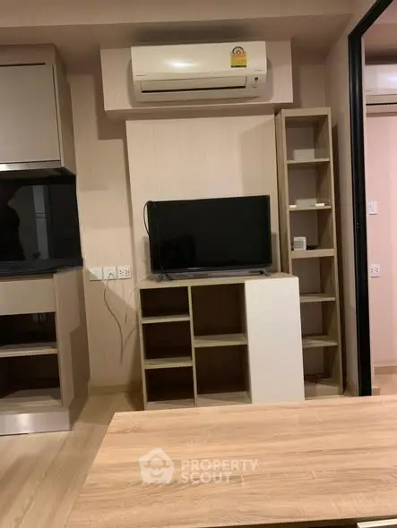 Modern living room with air conditioning and sleek wooden furniture