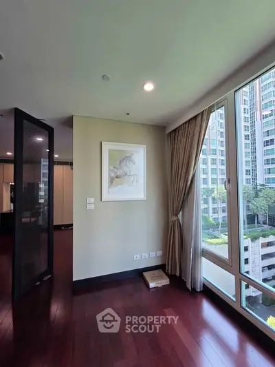 Spacious corner unit with large windows offering a stunning view of the cityscape, perfect for modern living.