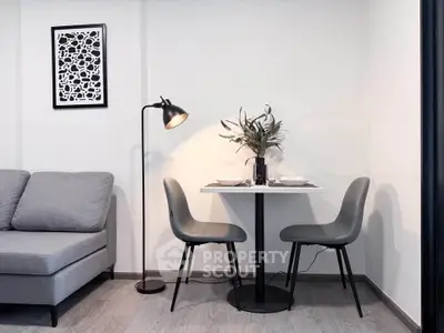 Modern living room with cozy seating and stylish dining area, perfect for urban living.