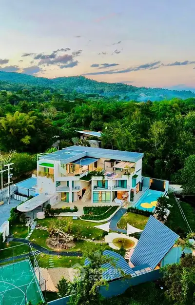 Luxurious modern villa with stunning mountain views and expansive outdoor space, perfect for serene living.