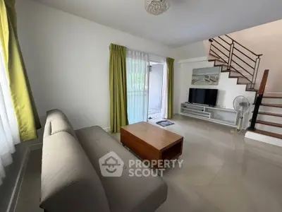 Modern living room with sleek furniture and natural light