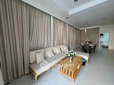 Spacious living room with modern furniture and elegant dining area