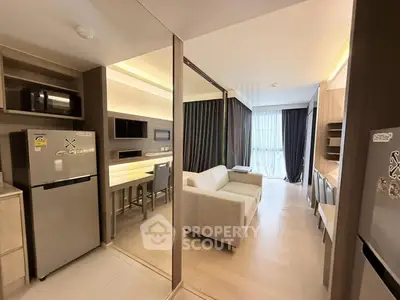 Modern open-layout kitchen and living room with sleek design and natural light
