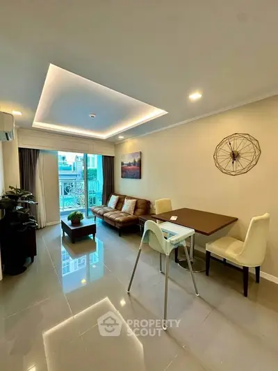 Modern living room with stylish decor and balcony view