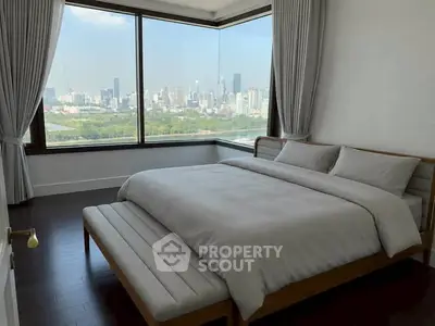 Luxurious bedroom with panoramic city view and elegant decor