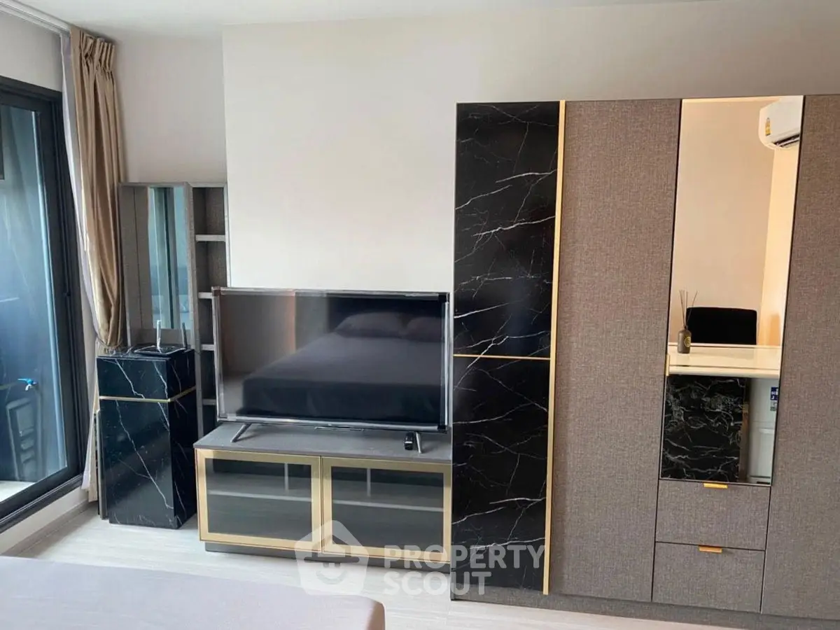 Modern living room with sleek TV stand and stylish storage cabinets