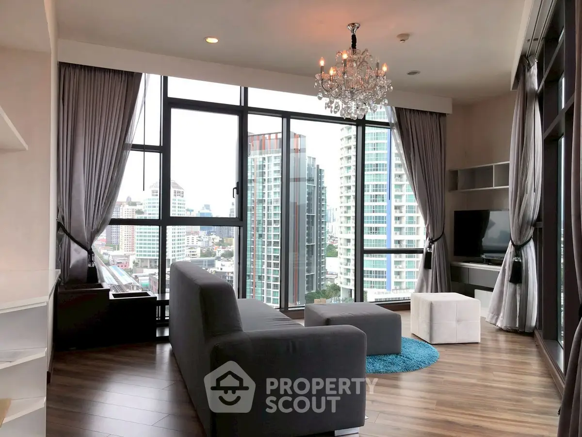 Luxurious living room with panoramic city views and elegant chandelier