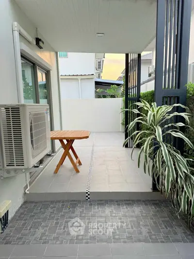 Charming modern patio with air conditioning and stylish outdoor table