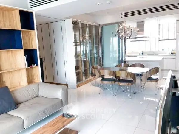 Modern open-plan living and dining area with sleek kitchen design