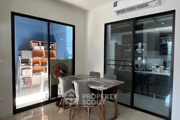 Modern dining area with glass doors and air conditioning
