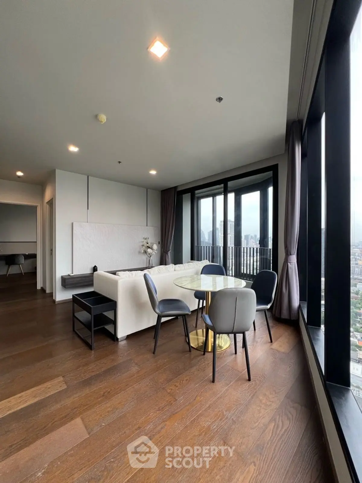 Luxurious modern living room with city view and elegant furnishings