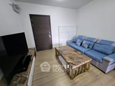 Modern living room with stylish blue sofa and marble coffee table