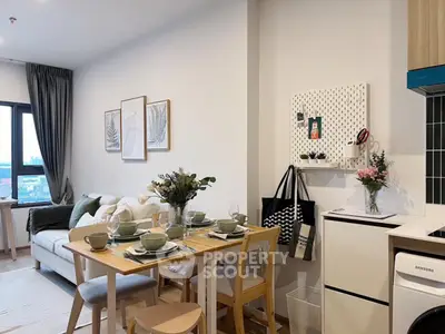 Modern open-plan kitchen and dining area with stylish decor and natural light
