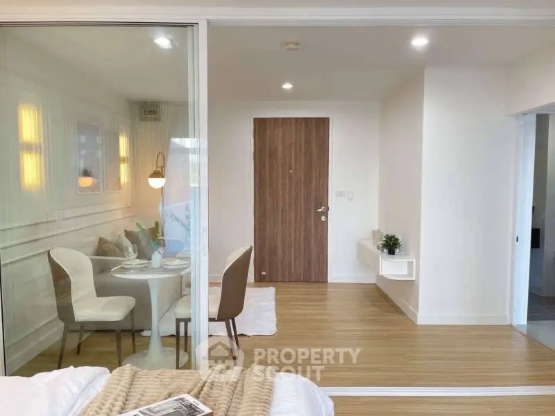 Modern studio apartment with cozy dining area and stylish decor