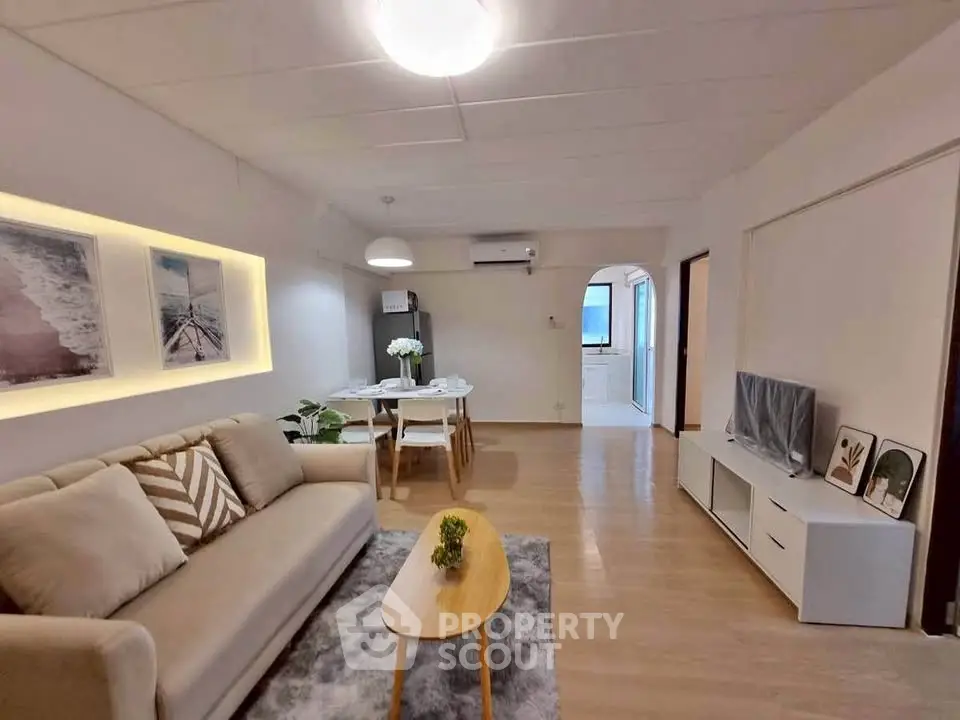 Spacious living room with modern decor and cozy ambiance