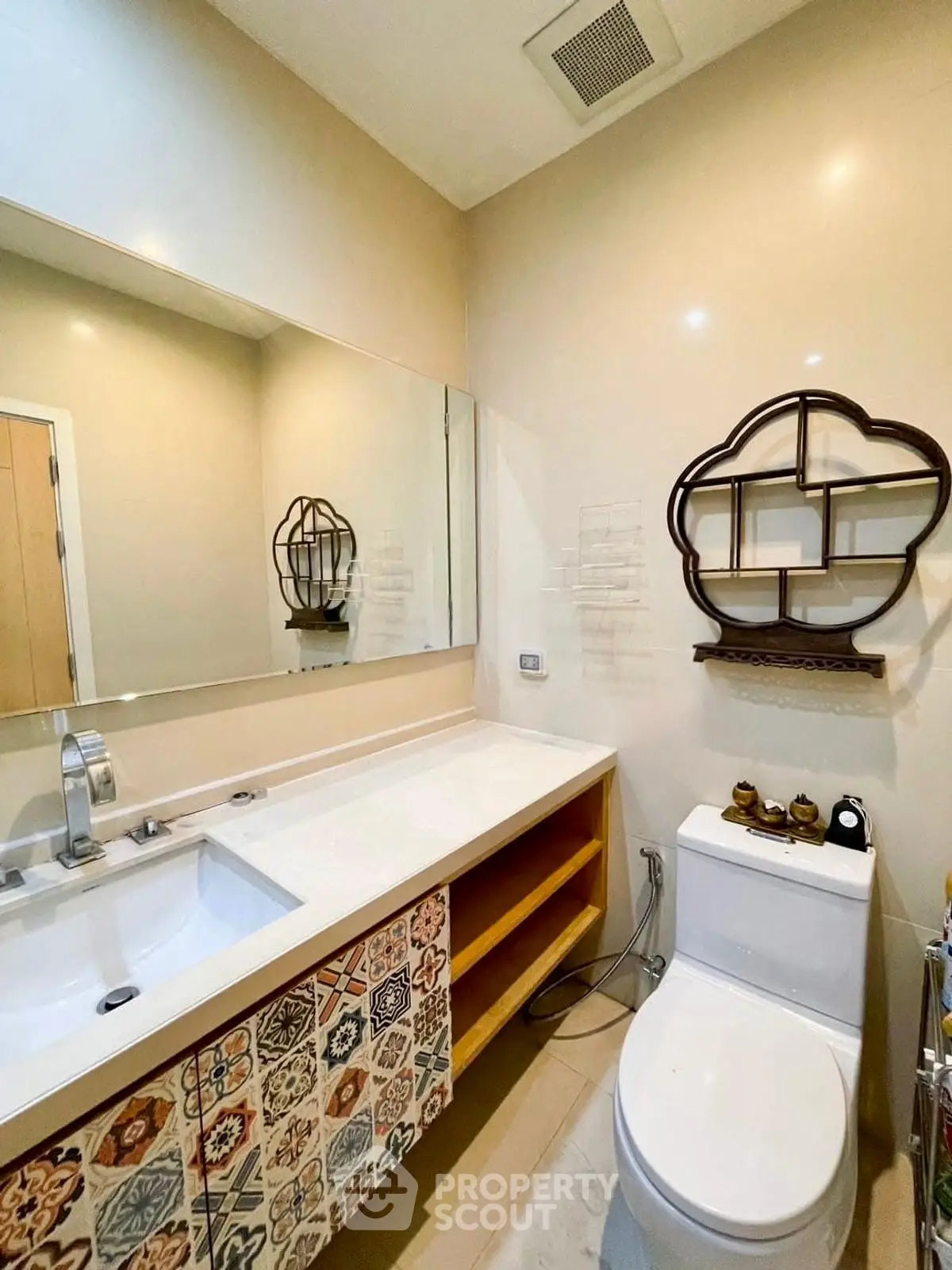 Stylish bathroom with modern fixtures and decorative shelving