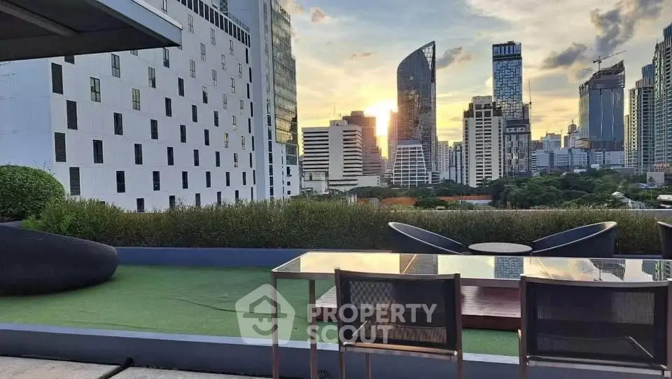 Stunning cityscape view from modern rooftop terrace with sleek furniture and lush greenery.