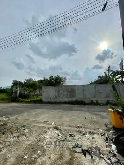 Vacant land with potential for development under a bright sky