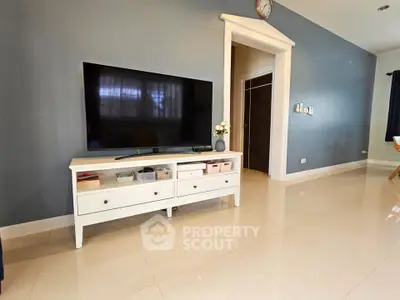 Modern living room with sleek TV setup and elegant decor