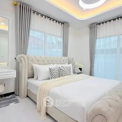 Luxurious bedroom with elegant decor and plush bed in modern home