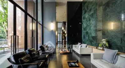 Luxurious modern living room with high ceilings and elegant decor, featuring floor-to-ceiling windows and stylish furniture.