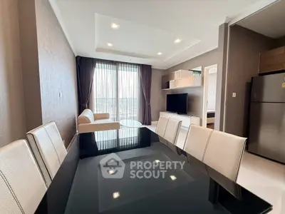 Modern living room with elegant dining area and large windows